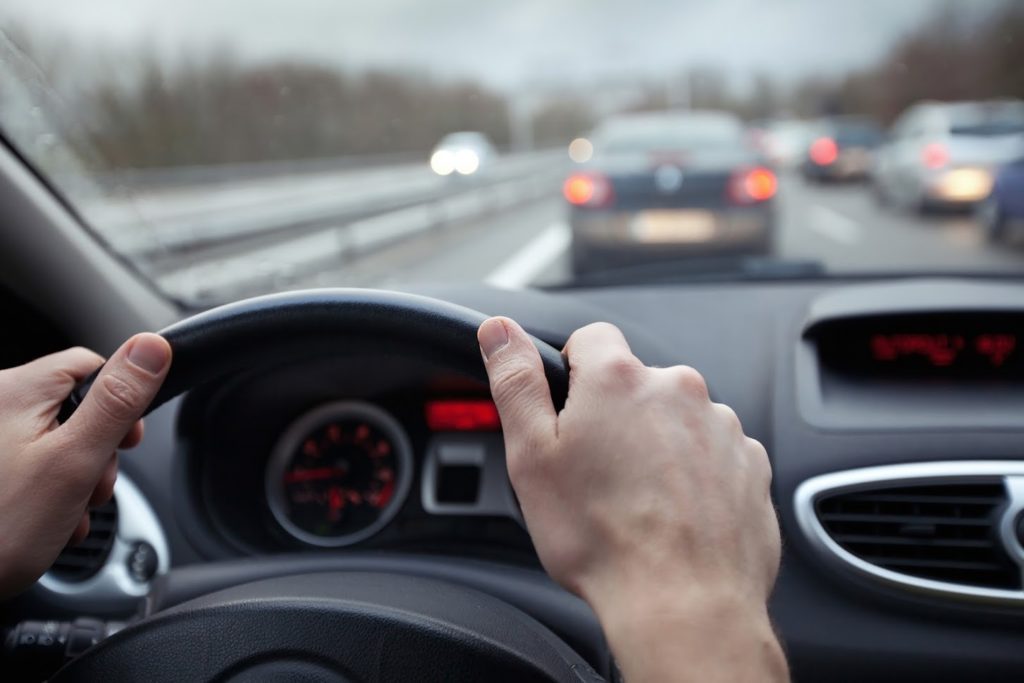 person driving in traffic